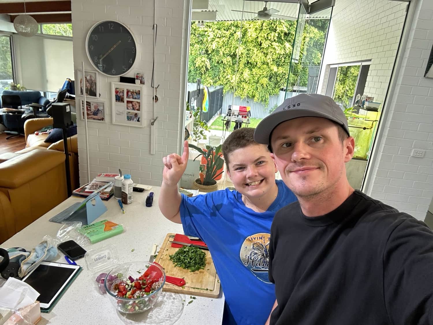 A Horizons support worker and participant cooking together at home