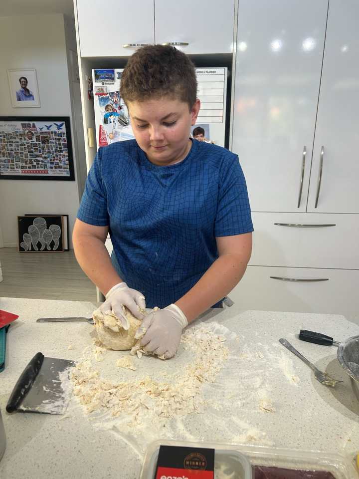 Peter baking in a kitchen