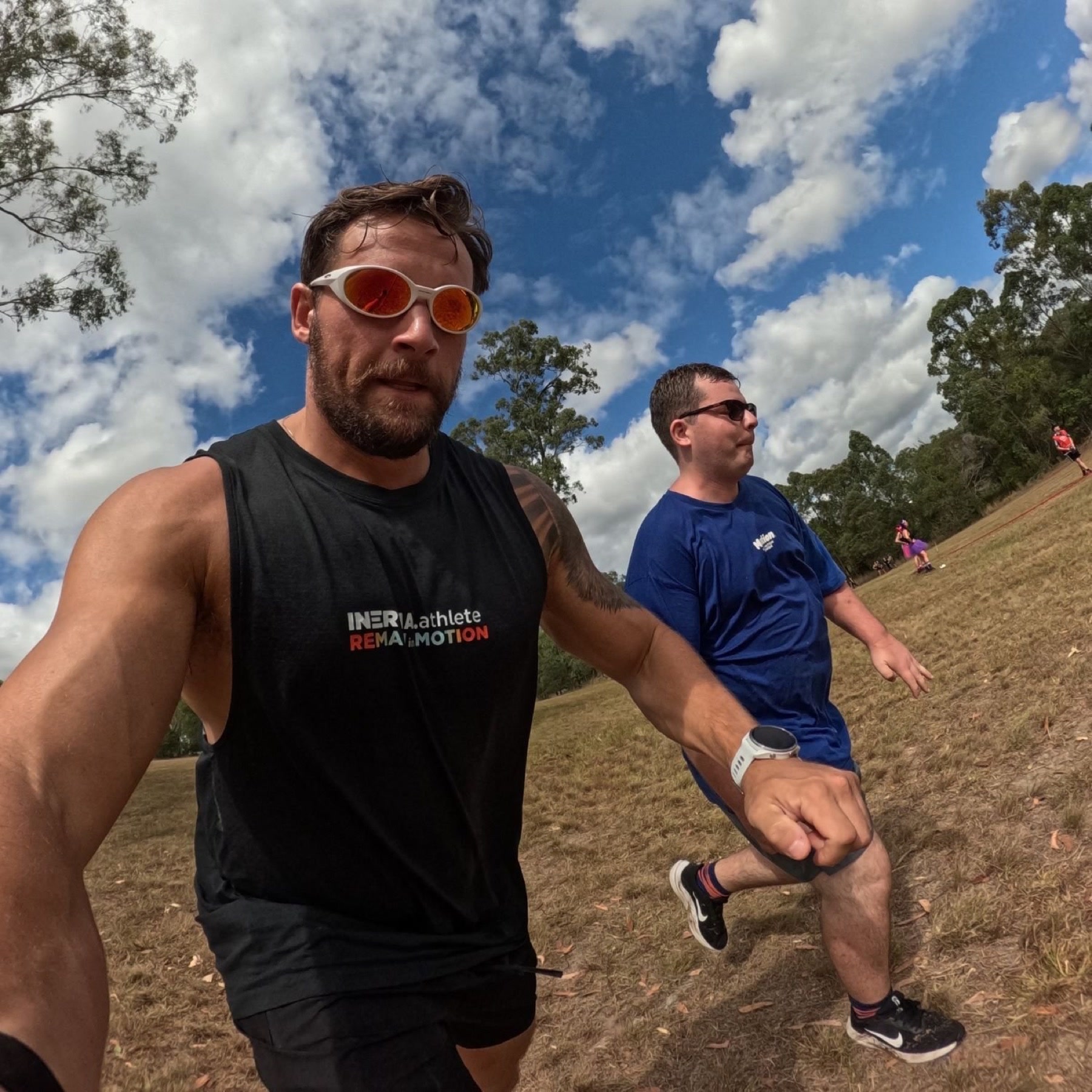 Chris Marshall and a participant taking part in an outdoor running activity