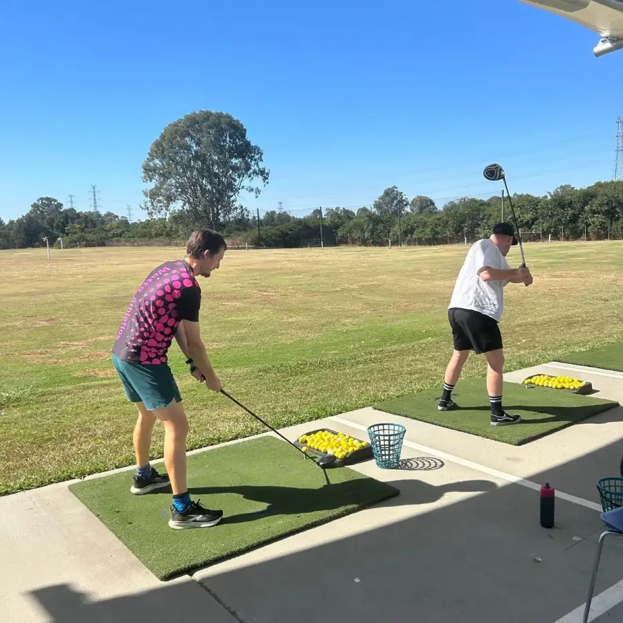 Participant and support worker taking part in a community activity